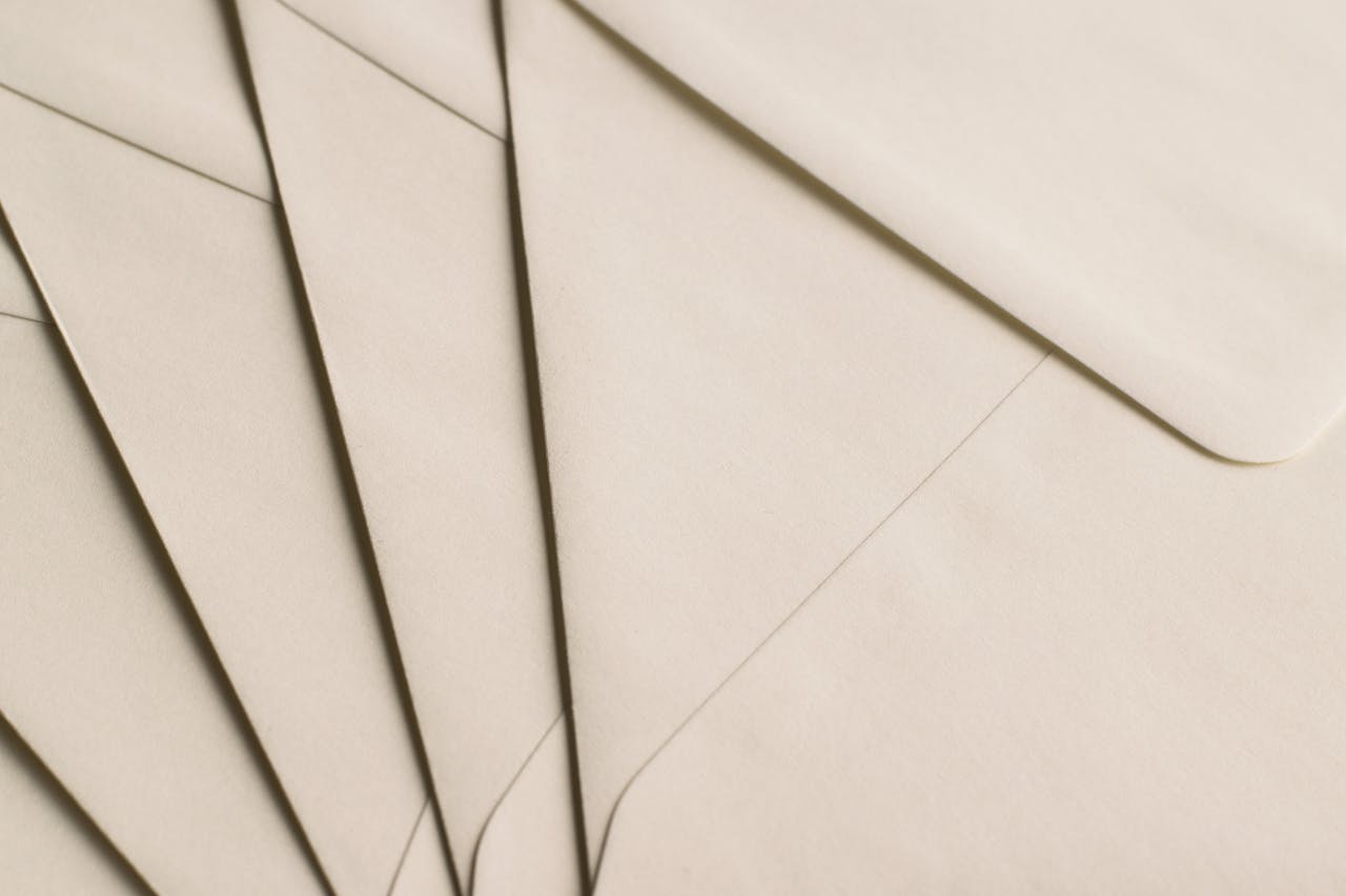 services-03 A close-up photo of beige envelopes arranged on a neutral background, ideal for stationery themes.